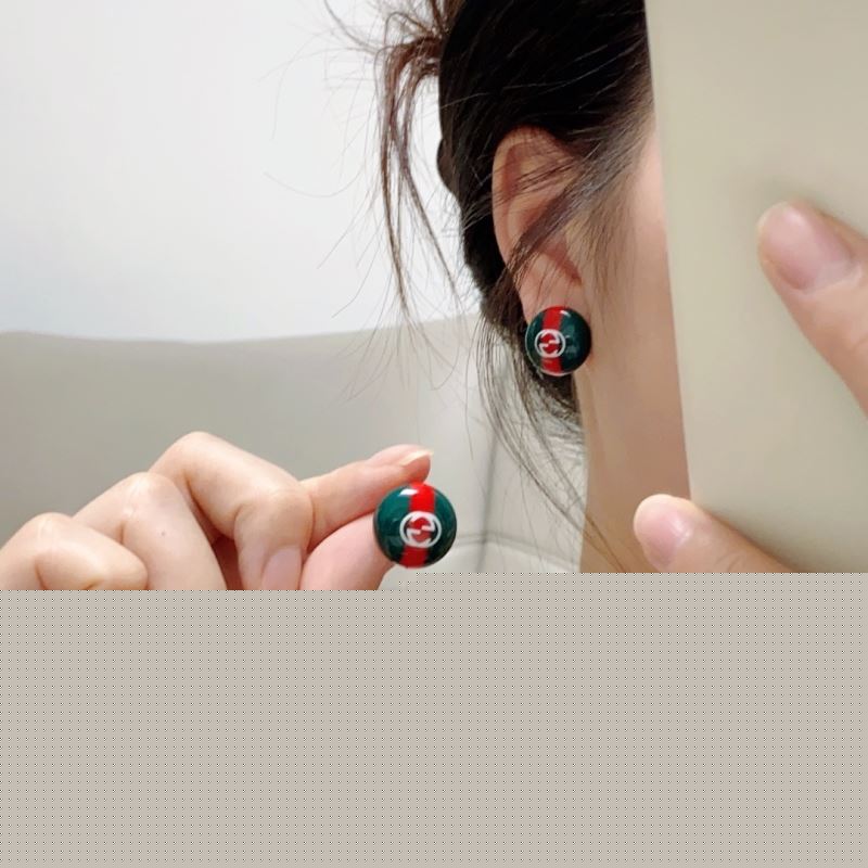 G*u*i earrings